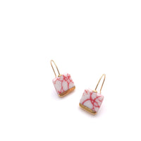 Square shaped dangle earrings in gold made out of ceramic porcelain