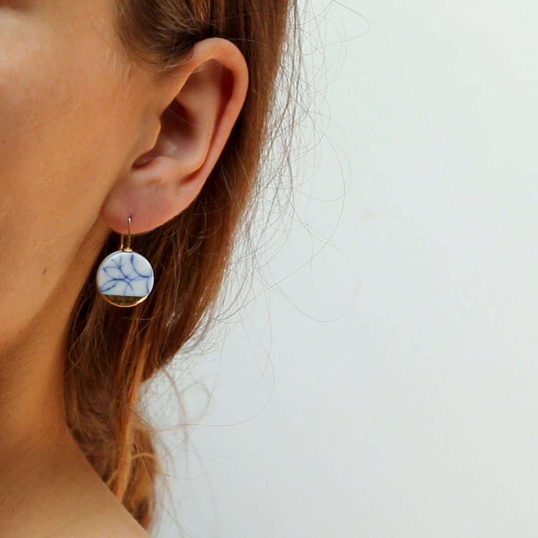Blue white earrings sales