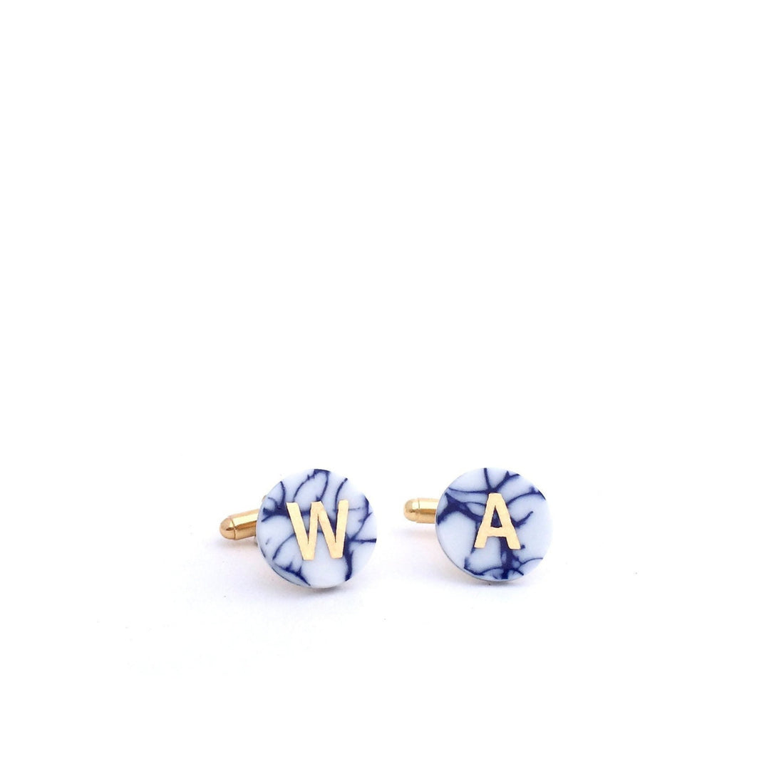 Handcrafted porcelain cufflinks with personalised gold initials. A refined and meaningful anniversary gift, made in Delft, The Netherlands.