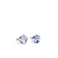 Handcrafted porcelain cufflinks with personalised gold initials. A refined and meaningful anniversary gift, made in Delft, The Netherlands.