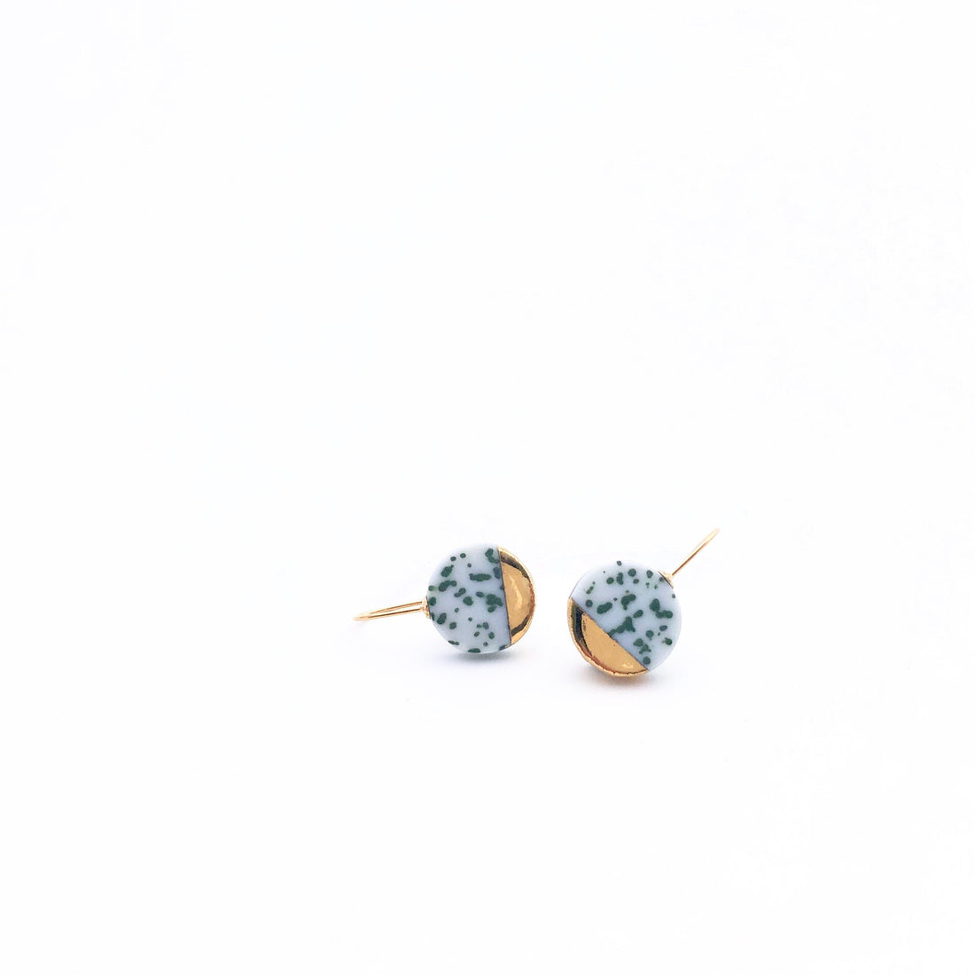 Handcrafted olive speckled porcelain earrings with 24K gold luster. Lightweight, durable, and inspired by Delft Blue tradition. A refined 18-year anniversary gift.